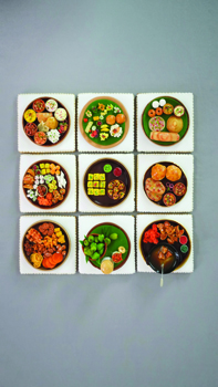 Food from across India recreated with royal icing on small cookies of around 3.5 to 4 inches,