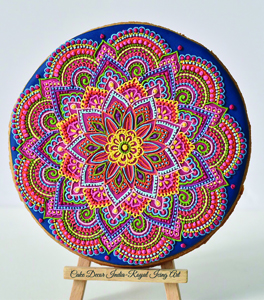 A 4-inch cookie with Mandala design using royal icing,